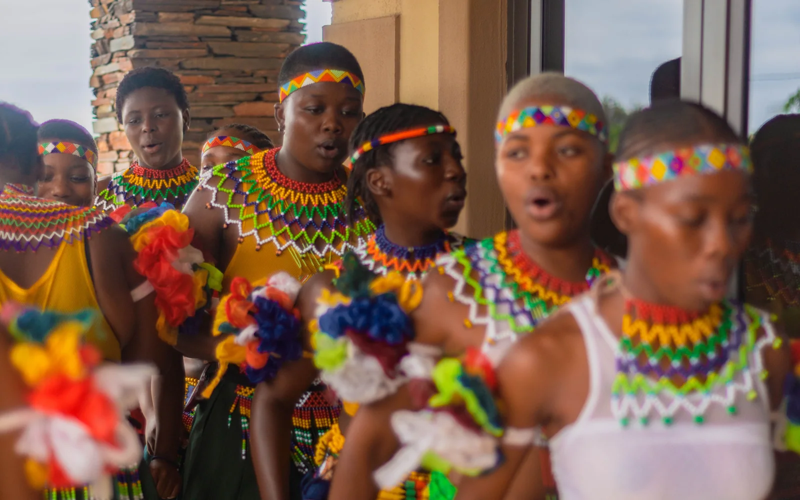 A Southern African dance performance in colourful beaded costume, photographed in South Africa (representative photograph of a cultural dance performance, not Lesedi's own boma)